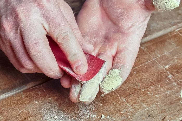 how to get super glue off skin with Sandpaper